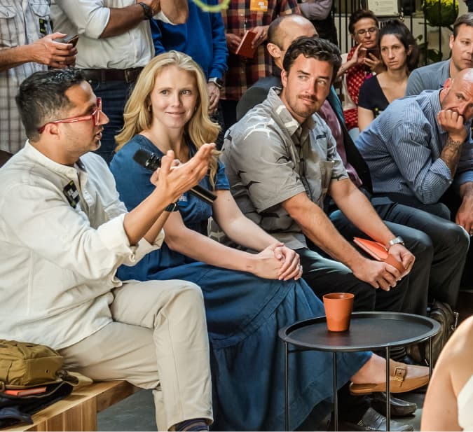 Attendees sharing a laugh at Dirty Jobs Summit